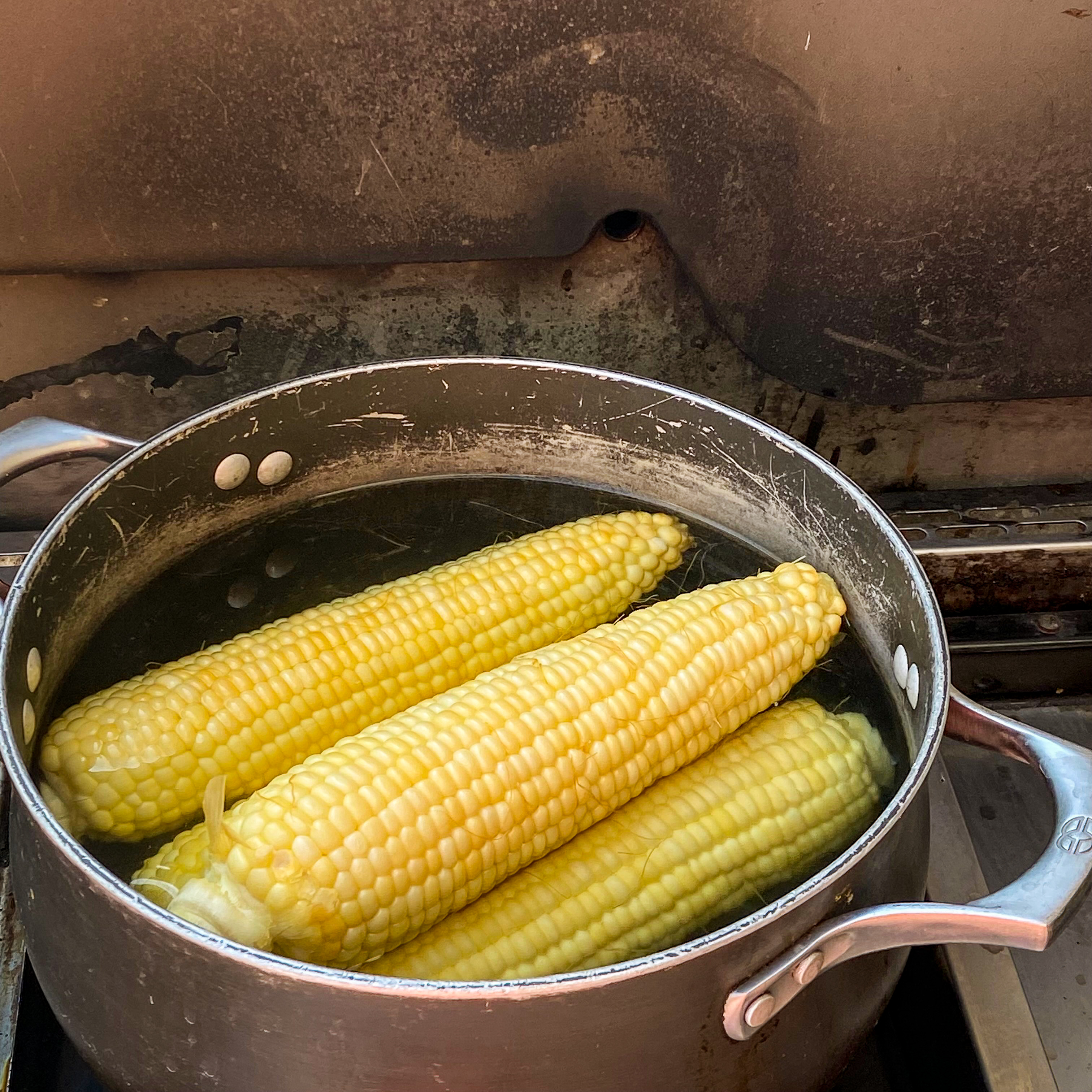 Blanch corn in boiling water to keep corn kernels plump before charring on the grill.  