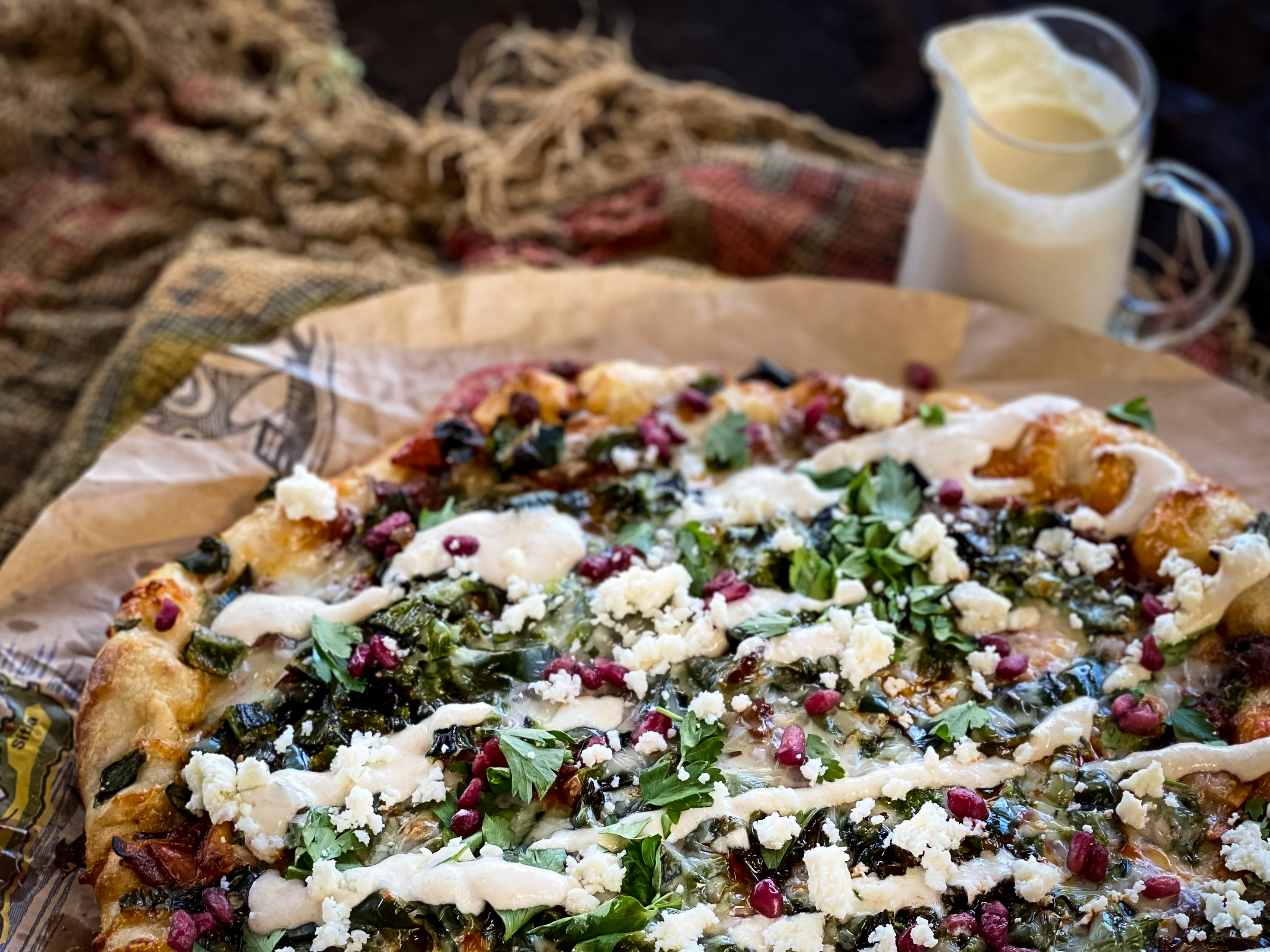 Close up of a Chiles en Nogada Pizza.