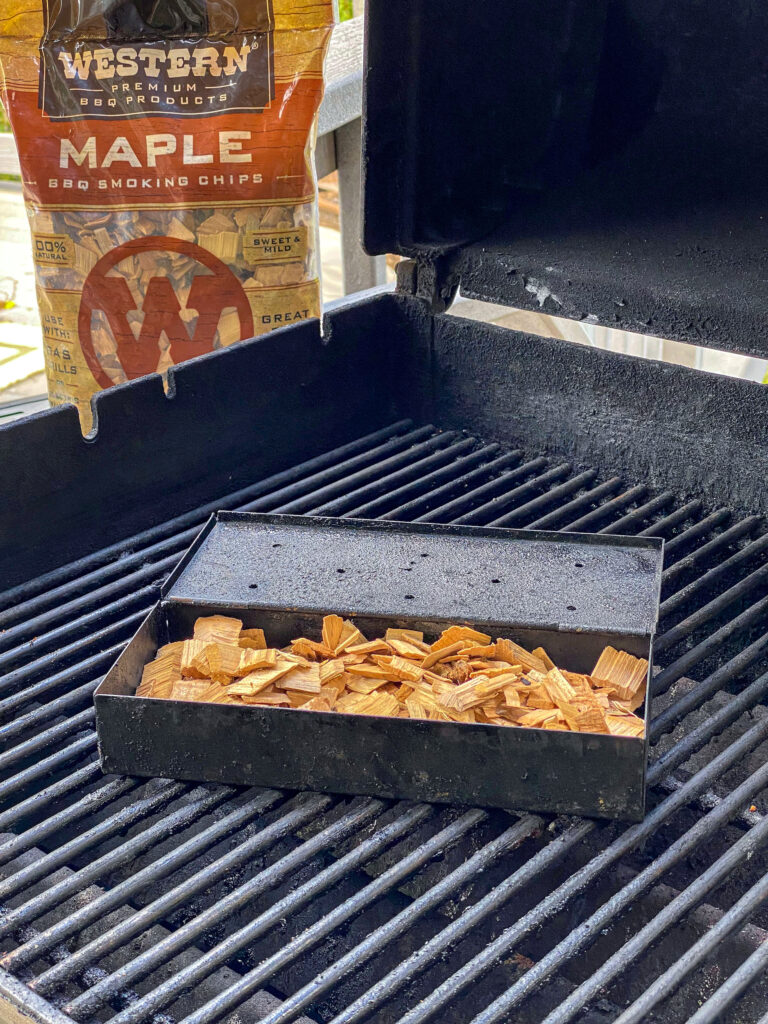 Fill the smoker box with smoking bbq chips but do not over-stuff. 
