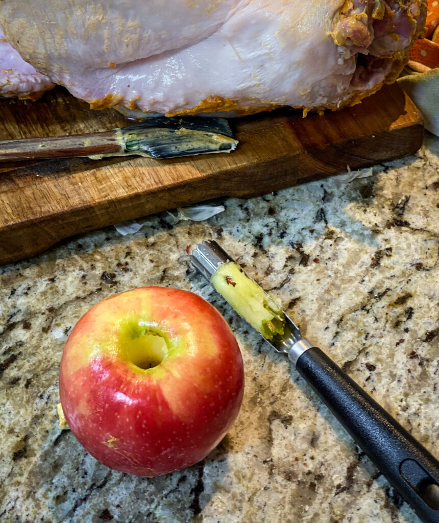 An apple with the core removed with a strawberry huller!