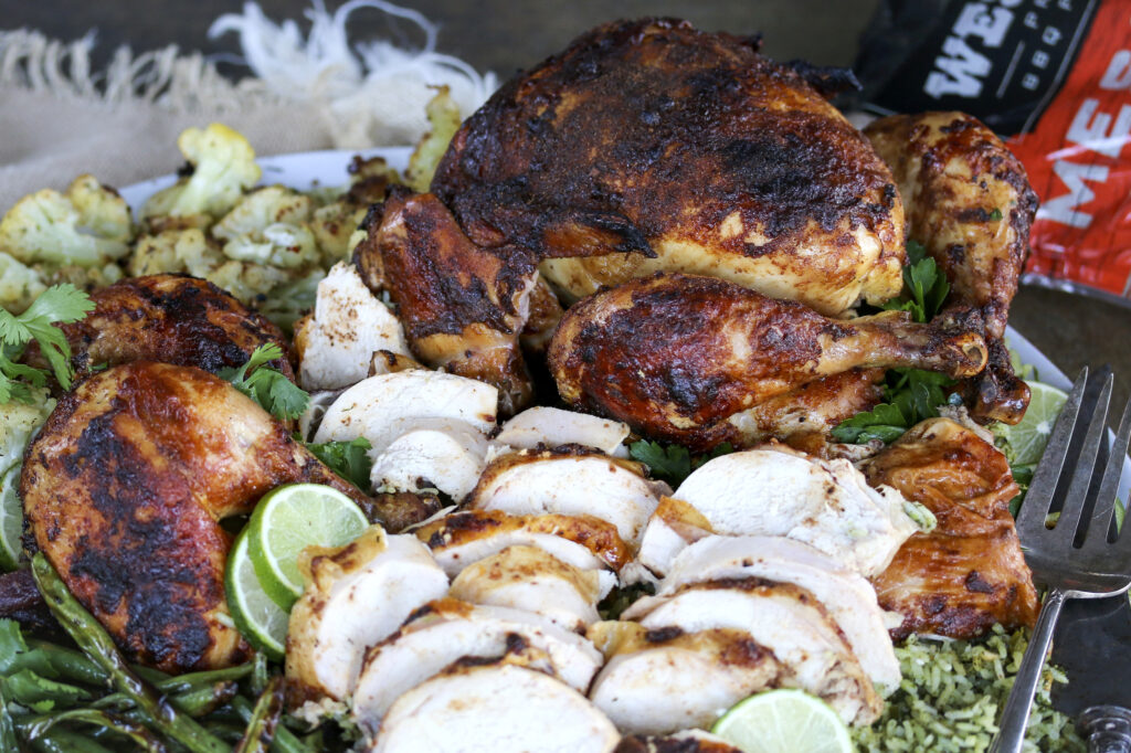A close up of smoked rotisserie chicken.
