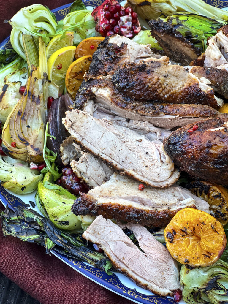 Sliced duck on a platter is ready for a holiday meal. 