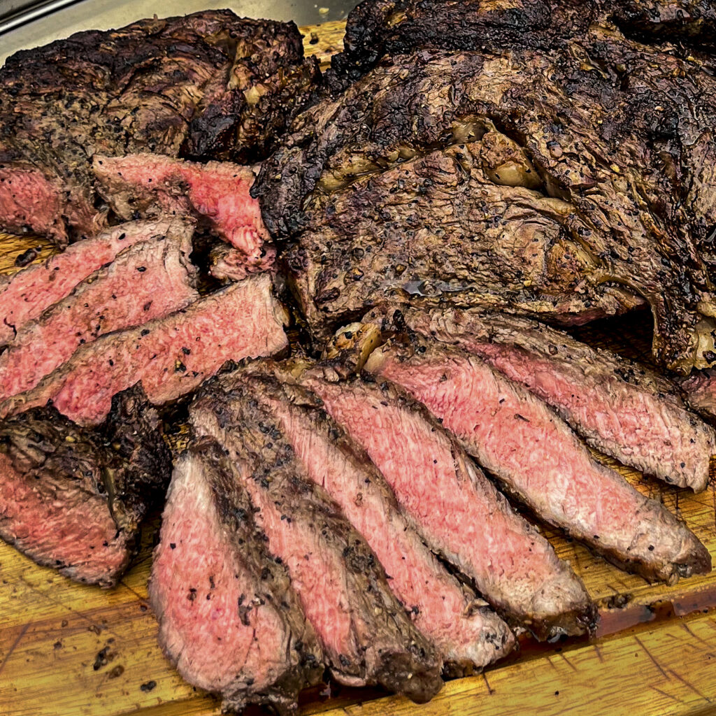 A sliced ribeye steak shows off pretty pink. 