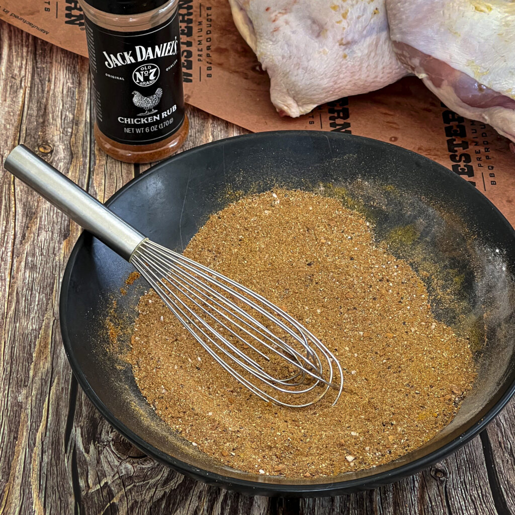 Spices blended with a whisk ready to go on chicken. 