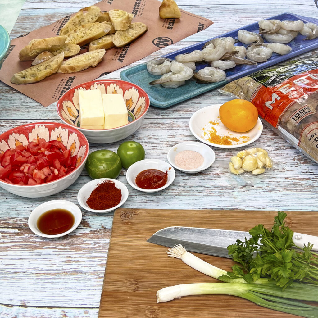 Ingredients are lined up for shrimp scampi. 