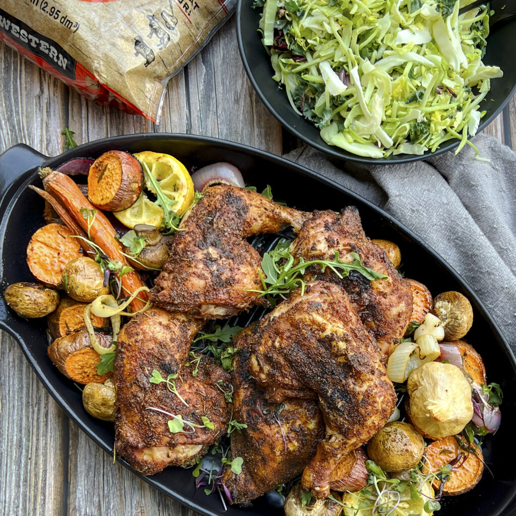 A platter of chicken leg quarters are ready to serve. 