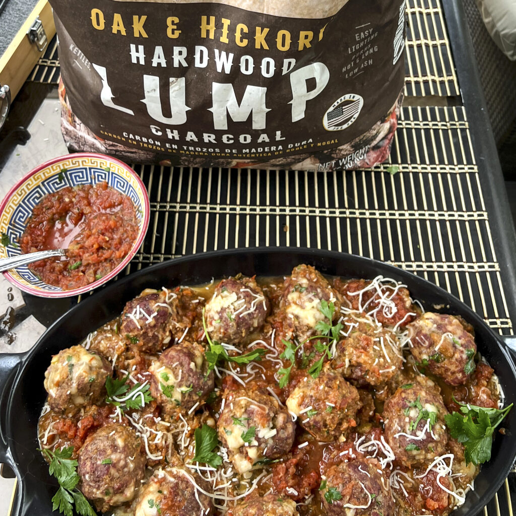 Smoked meatballs are in a serving dish.