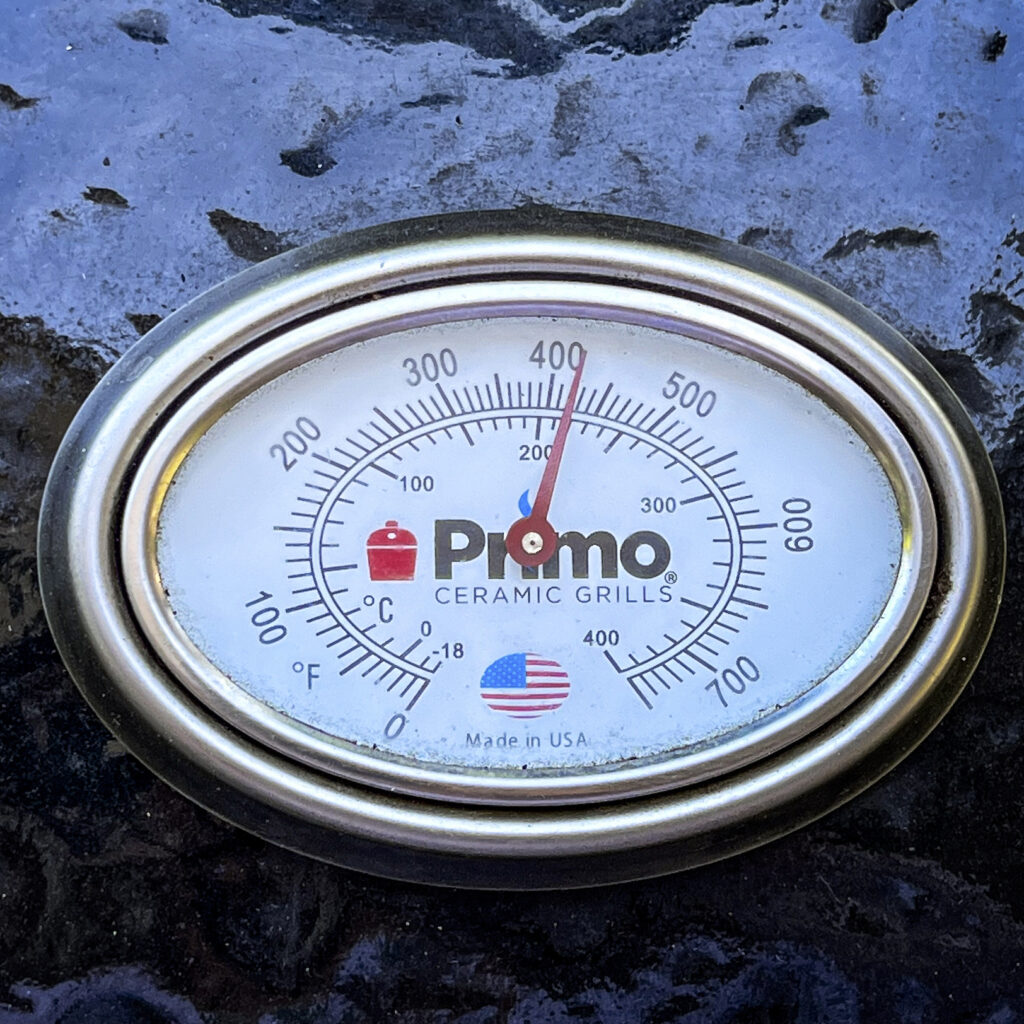 A photo showing a close up of 420°F on a grill. The temperature to begin baking cornbread.