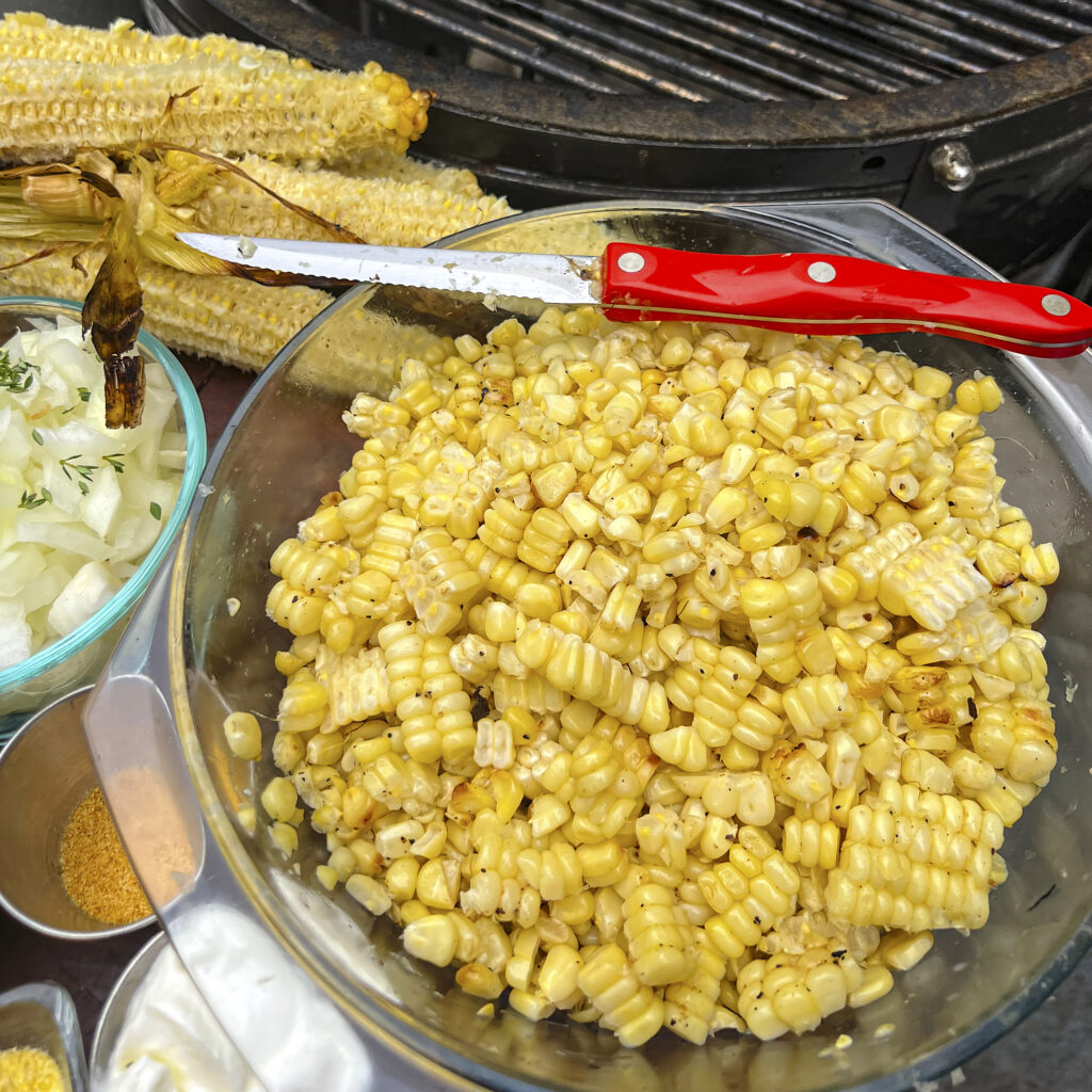 A bowl of grilled corn kernels ready to be frozen