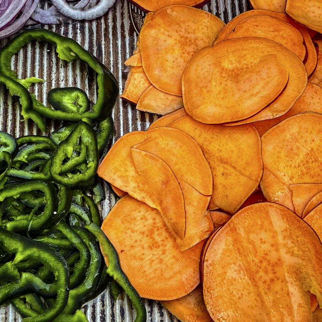 Thinly sliced sweet potatoes and poblano peppers are ready for the grill. 