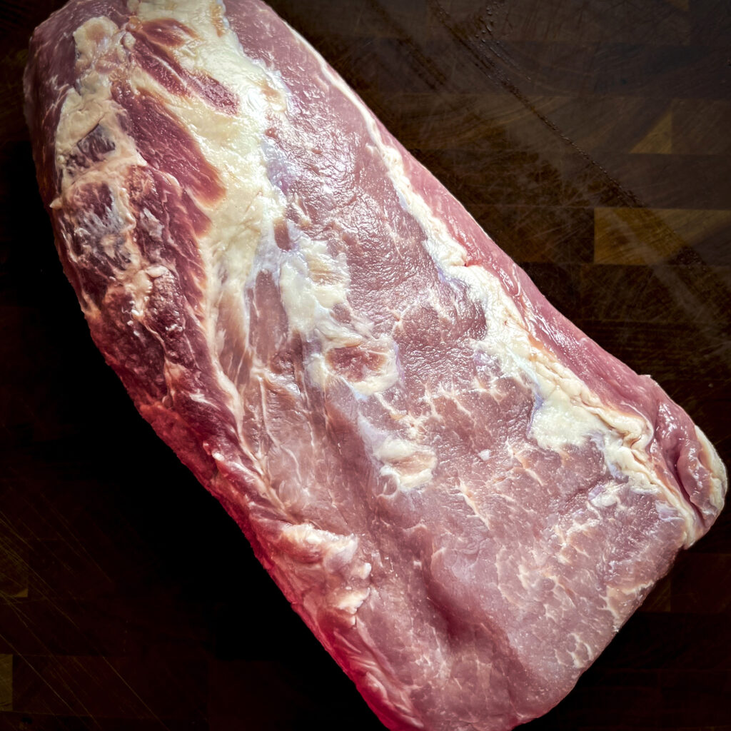 A pork loin is in the photo to show how lean it is,. 