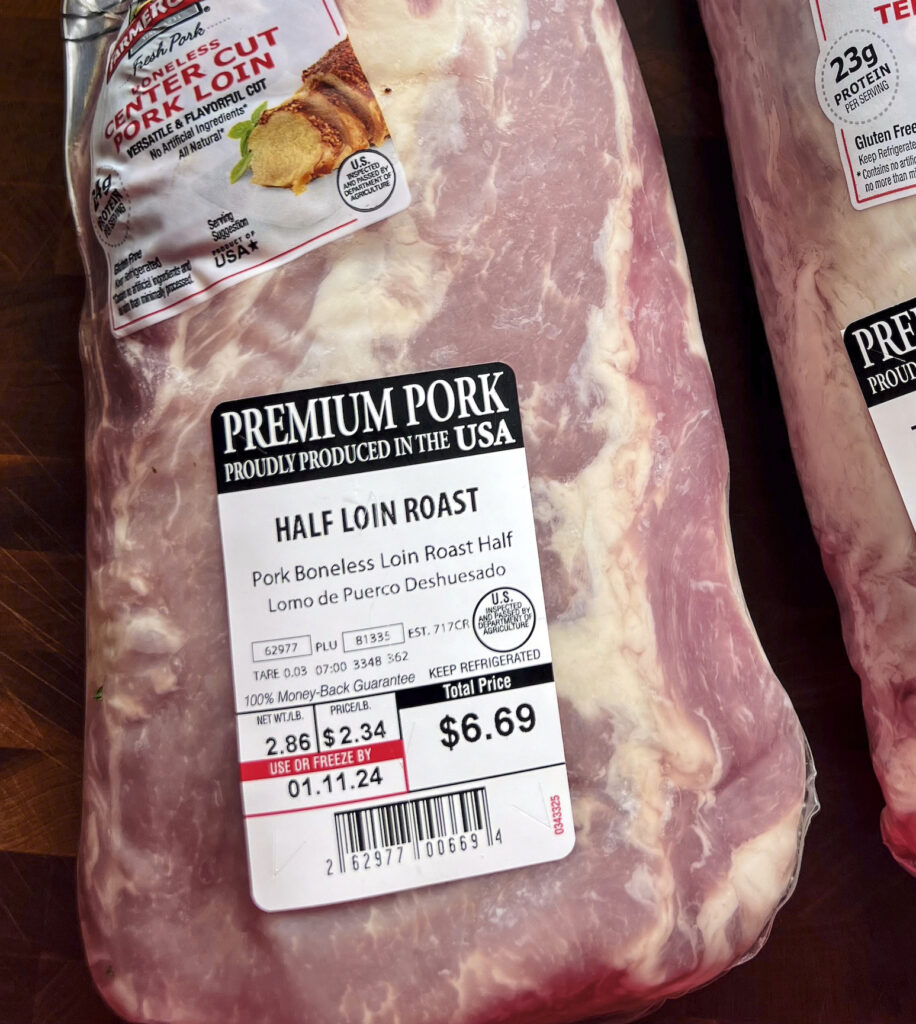 A pork loin still in the package to show how inexpensive it is. $6.69 for 2.8 pounds. 