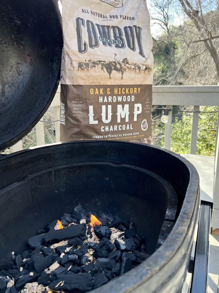 Cowboy Brand Oak and Hickory Lump Charcoal is near a Primo Ceramic Grill. 