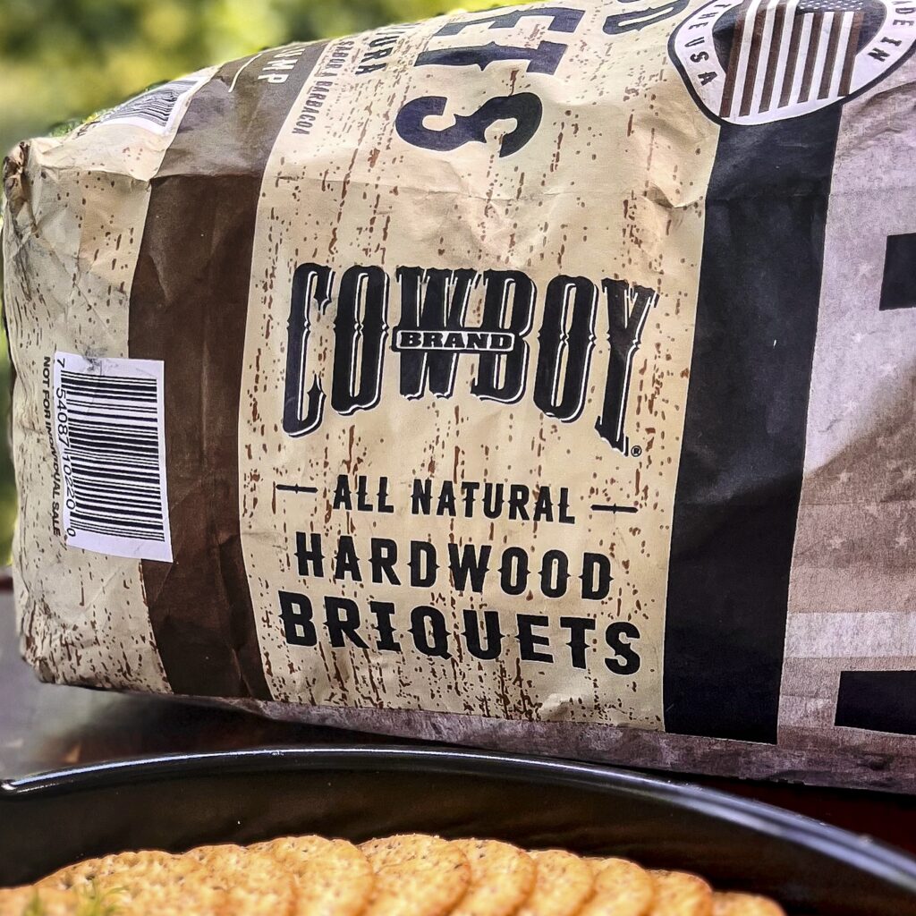 A bag of Cowboy Hardwood Briquets.